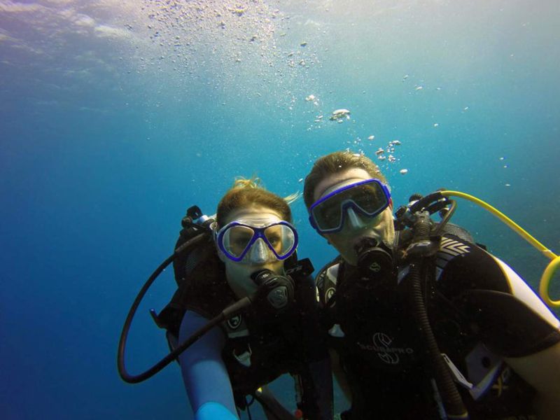 Two equipped divers below the surface