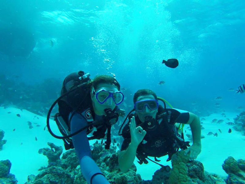 Two smiling beginners during their first dive